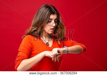 The Girl In Glasses Looks At The Watch. Hurry Up. Appreciate Your Time. Do Not Be Late. Isolated On 