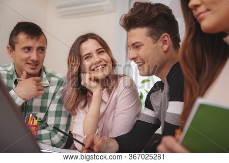 Group Of Young People Studying Together At College Classroom