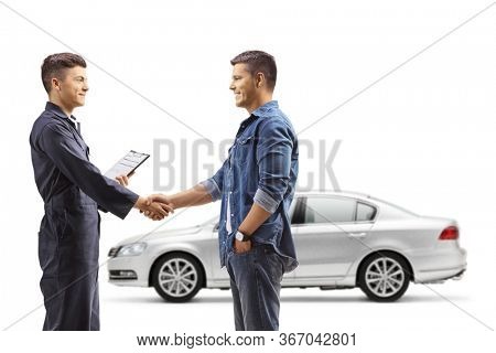 Man taking car to an auto repair shop and shaking hands with auto mechanic worker isolated on white background