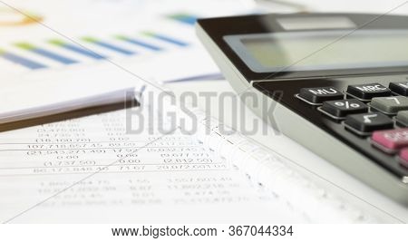 Construction Project Planning, Drawing, Calculator And A Pen