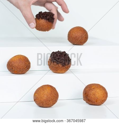 Deep Fried Bunuelos Balls. Creative Minimalist Composition On A White Background.