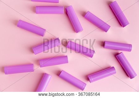 Power Batteries On A Pink Background. Monochrome. Flatlay Style.