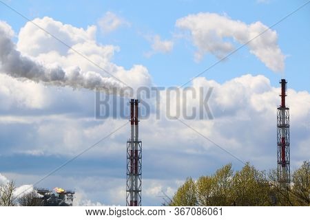 Close-up Shot Of Smoke Pipe: Industrial Production, Factory, Air Pollution. Dense Smoke Comes From I