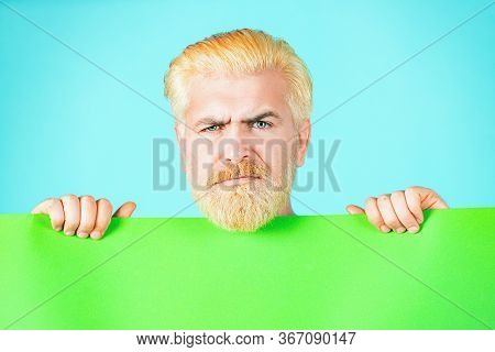 Business Content Presentation. Serious Man Holding Empty Placard Board For Media Banner. Man Holding