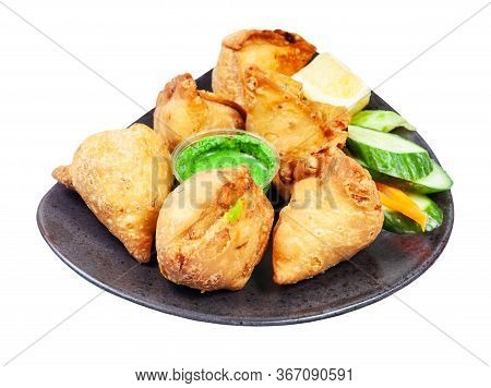 Indian Cuisine - Many Samosas (fried Savoury Pastry) On Black Plate Isolated On White Background