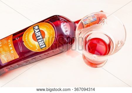 Moscow, Russia - May 10, 2020: Glass With Vermouth And Lying Bottle Of Martini Fiero On Light Brown 