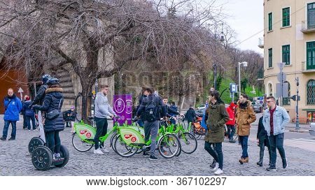 Budapest, Hungary - 03 16 2019 : Young Tourists Use The Mols Bubi Bikes At The Buda Castle Tunnel.