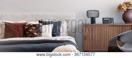 Trendy Bedroom With Comfortable King Size Bed In Modern Flat, Real Photo