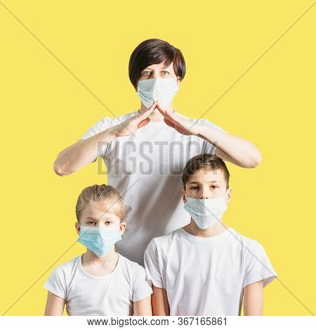 Woman Children Boy Girl In Medical Masks For Protection Against Coronovirus Disease. Concept For Sto