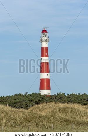 The Red And White Striped Lighthouse Of The Wadden Island Of Ameland In The North Of The Netherlands