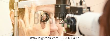 Eye Doctor Diagnostic. Patient At Medical Clinic. Cataract Ophthalmology Exam. Astigmatism Examinati