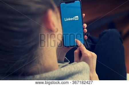 Kyiv, Ukraine-january, 2020: Linkedin On Smartphone Screen. Young Girl Pointing Or Texting Smart Pho