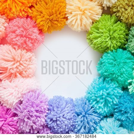 Pompons Of Colored Yarn. White Background. Bright Colours.