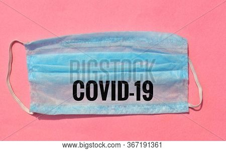 Covid-19 Written On Surgical Or Medical Face Mask