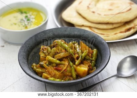 Sengri aloo ki sabzi, simmered radish pods & potatoes with spices, indian cuisine