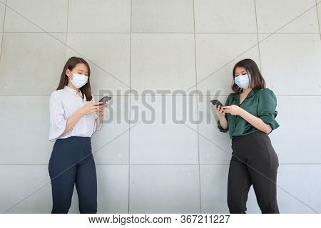 Business Employees Wearing Mask During Work In Office To Keep Hygiene Follow Company Policy.preventi