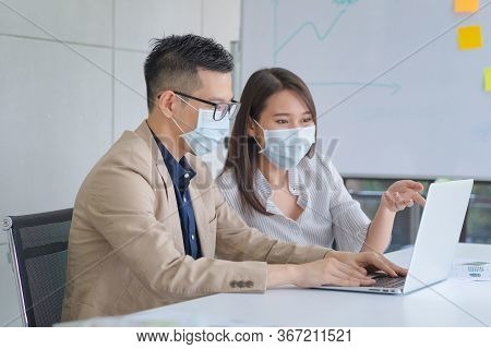 Business Employees Wearing Mask During Work In Office To Keep Hygiene Follow Company Policy.preventi