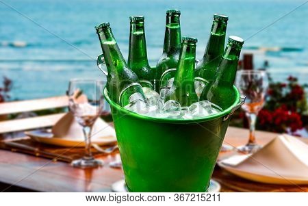 Bucket of beer with ice at the beachside restaurant