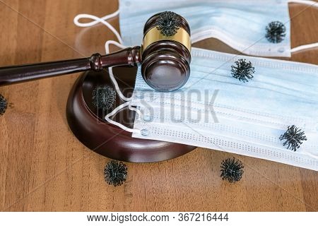 Coronvirus Control Concept. Judgment Of Mandatory Wearing Of Medical Masks. Wooden Skein Of Judge Sy