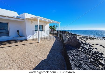 Puerto Del Carmen Beach In Lanzarote, Canary Islands, Spain. Tourist Information Centre, Blue Sea, P