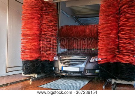 Foam Water Clean Auto Car On Carwash Hand Service. Vehicle Wash Soap, Foam On Cleaner Station. Autom