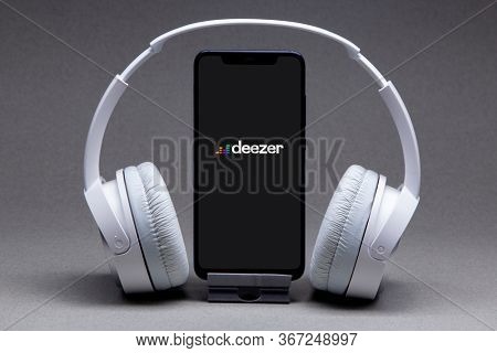 Belgorod , Russia - MAY, 16, 2020: Mobile phone with Deezer logo on screen, Stream Songs and Videos app