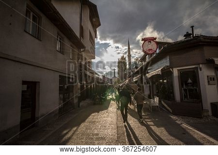 Sarajevo, Bosnia And Herzegovina - April 17, 2017: Street With Tourists And A Mosque Minaret In The 