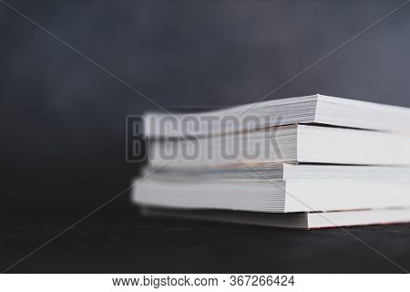 Stack Of Books Shot From Eye Level With Shallow Depth Of Field.
