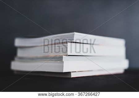Stack Of Books Shot From Eye Level With Shallow Depth Of Field.