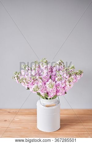 Bouquet Of Beautiful Lilac Mattiola. Spring Flowers In Vase On Wooden Table. Flowers Delivery.