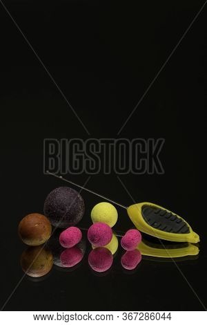 Bright Green, Red Boilies, Fishing Baits For Carp Isolated On Dark Background.
