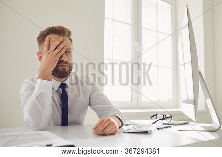 A Lot Of Work In The Office. Tired Busy Businessman Is Working With Computer.