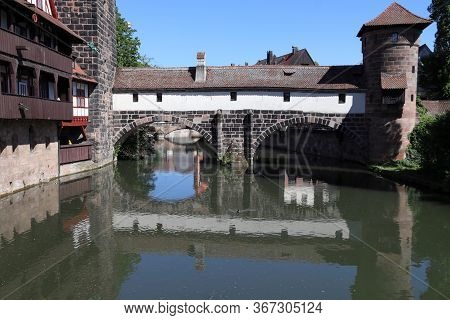 Nuremberg City, Germany - Wasserturm Medieval Tower, Henkersteg Bridge And Henkerhaus.