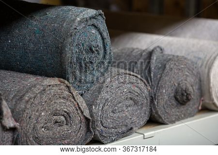 Covering Non-woven Material In Rolls On The Shelves Of The Warehouse. Stocks Of Cloth And Rags. Copy