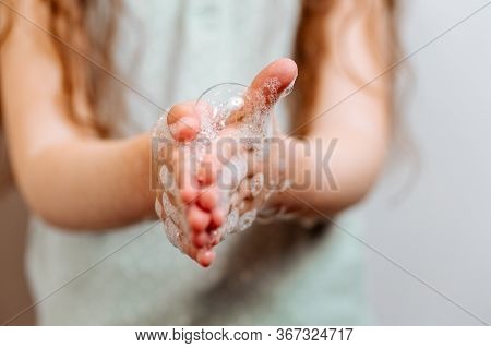 Childrens Hands In Soapy Foam. Remember To Wash Their Hands