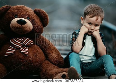 Dad And Son Play In Nature. The Child\'s Emotions And Delight. Warm Sunny Autumn Day In The Park. Fr