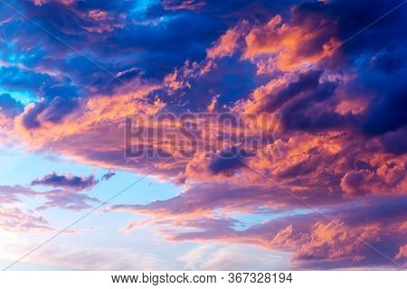 Dramatic Sky With Bright Red And Dark Blue Stormy Clouds. Nature Background