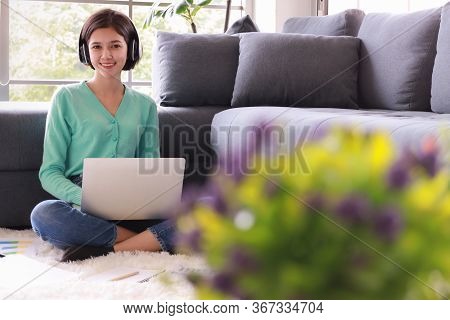 Young And Beautiful Cute Woman Half Race Thai-german Wearing Headphone And Using Laptop Notebook Com