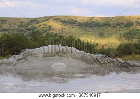 Paclele Mari Mud Volcano In Buzau, Romania. The Berca Mud Volcanoes Is A Geological And Botanical Re