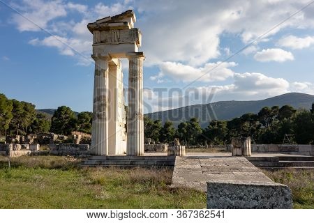 Temple Of Asklepios At Epidaurus, Greece With Stone Blocks At Early Sunset With Boulders Around