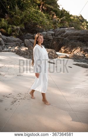 European Young Tan Women Have Rest On The Beach