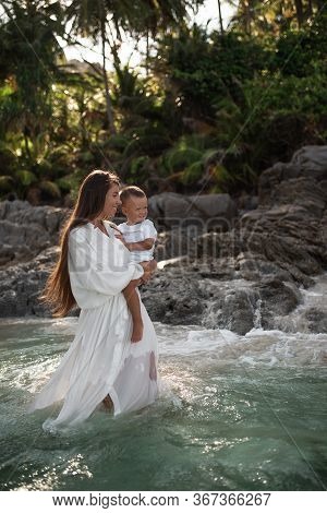 Happy Smile European Family Have Rest And Run On White Sand Beach