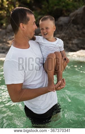 Happy Smile European Family Have Rest And Run On White Sand Beach