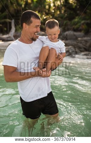 Happy Smile European Family Have Rest And Run On White Sand Beach