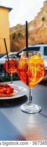 Spritz Aperol Drink With Venetian Traditional Snacks Cicchetti On The Background In Venice.