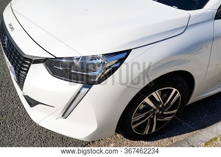 Bordeaux , Aquitaine / France - 02 11 2020 : Headlight New Peugeot 208 Front Car White Produced By T