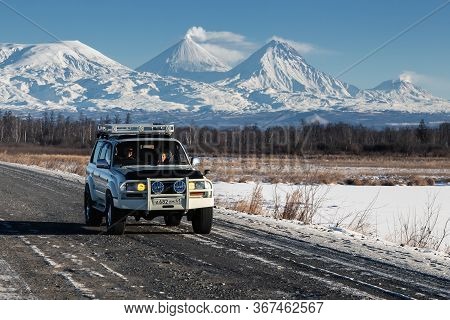 Japanese Sport Utility Vehicle Toyota Land Cruiser Driving Along Road On Background Beautiful Winter