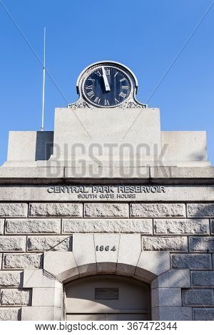 New York City - October 22:  A Clock Face Beside The Jackie Onassis Reservoir In Central Park, New Y