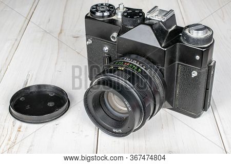 Group Of One Whole One Piece Of Vintage Camera On White Wood