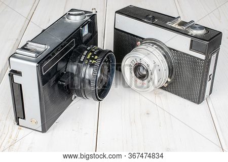 Group Of Two Whole Vintage Camera On White Wood